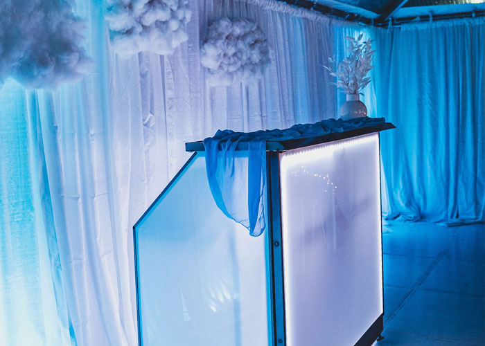 wedding tables set up under a wedding tent